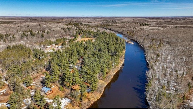 aerial view with a forest view and a water view