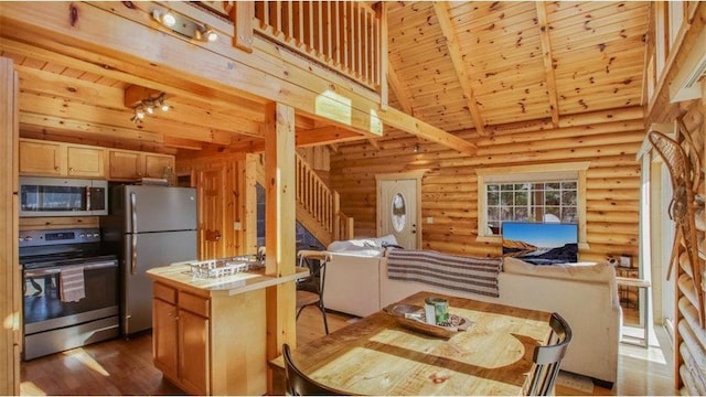 kitchen with wood ceiling, high vaulted ceiling, stainless steel appliances, and beam ceiling