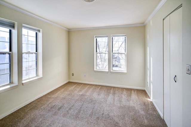 unfurnished bedroom with baseboards, multiple windows, ornamental molding, and light colored carpet