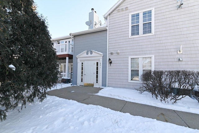 view of front of home featuring a chimney