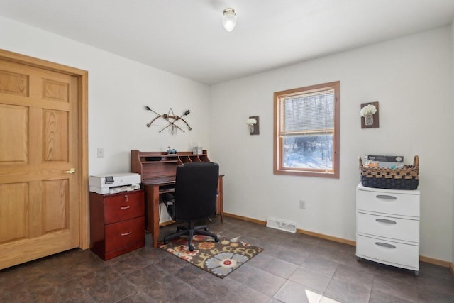 office area with visible vents and baseboards