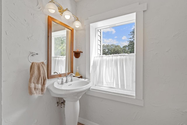 bathroom with a textured wall