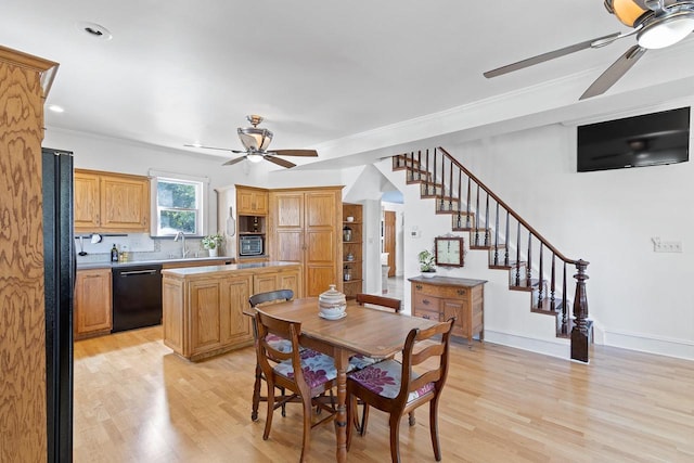 dining room with light wood-type flooring, baseboards, stairway, and a ceiling fan