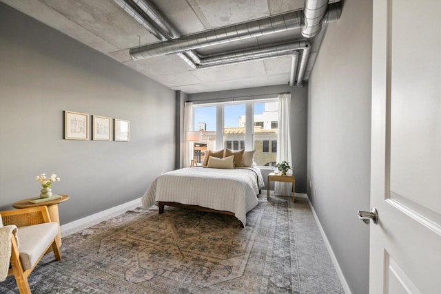 carpeted bedroom with baseboards