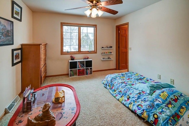 bedroom featuring light carpet, a ceiling fan, visible vents, and baseboards