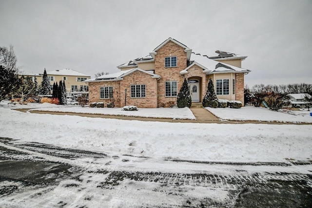 traditional-style home featuring brick siding