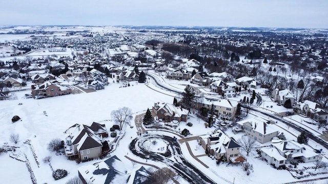 snowy aerial view featuring a residential view