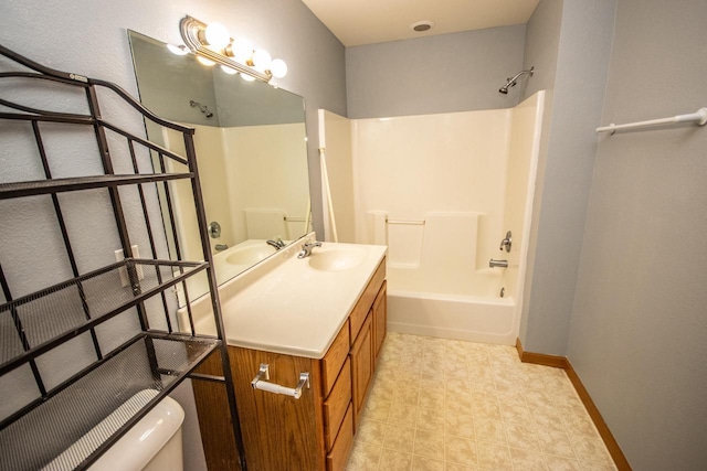 bathroom featuring toilet, shower / tub combination, vanity, and baseboards