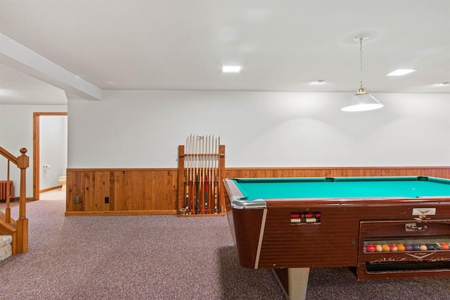 playroom with dark carpet, radiator heating unit, wainscoting, and wooden walls