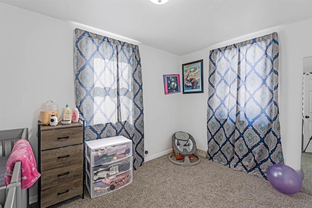 playroom featuring carpet flooring and baseboards