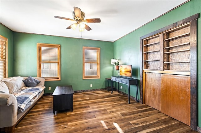 living room with dark wood-style floors and ceiling fan