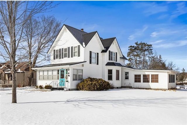 view of front of home with a standing seam roof and metal roof