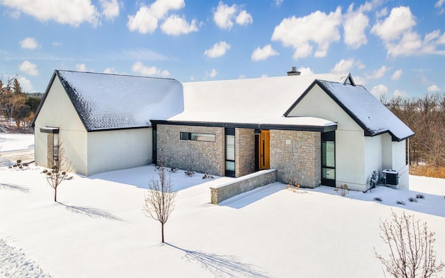 view of front of house featuring central AC and stucco siding