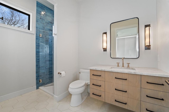 W4038 Maplewood Ln, Fond Du Lac, WI 54937 - full bath with baseboards, toilet, a stall shower, tile patterned floors, and vanity