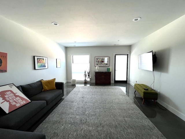 living room with recessed lighting and baseboards