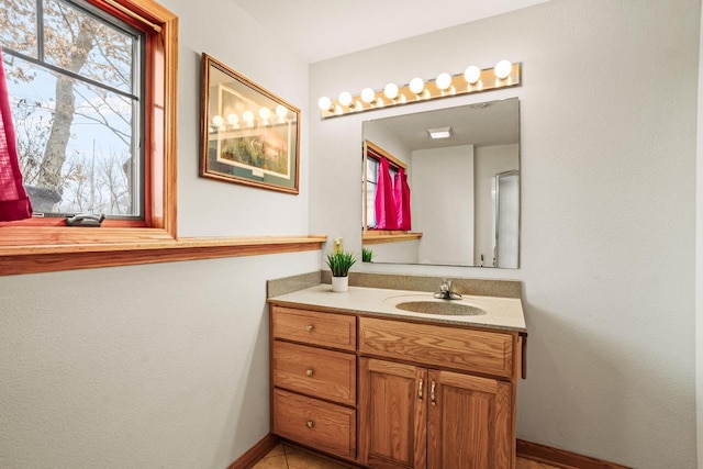 bathroom featuring vanity and baseboards