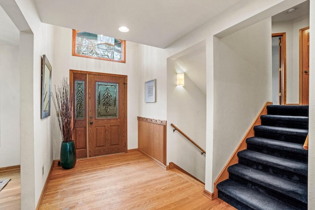 foyer with light wood-type flooring, baseboards, and recessed lighting