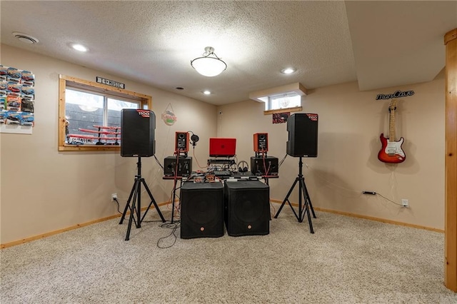 carpeted office featuring visible vents, baseboards, a textured ceiling, and recessed lighting