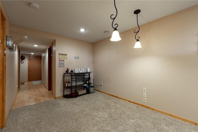 interior space with light carpet, baseboards, and recessed lighting