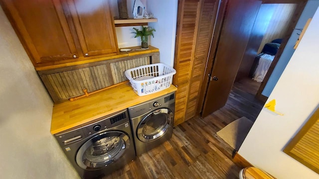 room details with wood finished floors and washer and dryer