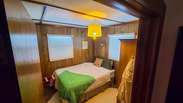 bedroom featuring wood walls