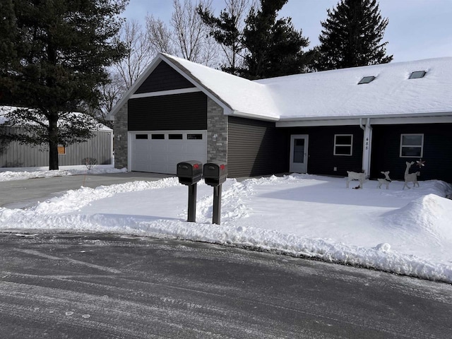 ranch-style home with an attached garage and concrete driveway