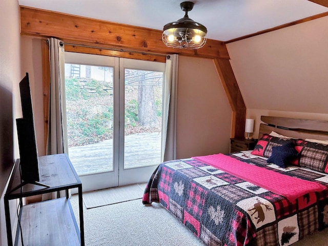 bedroom featuring carpet floors, access to exterior, and vaulted ceiling