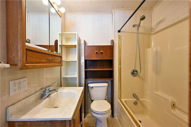 bathroom featuring shower / bath combination, toilet, vanity, and decorative backsplash