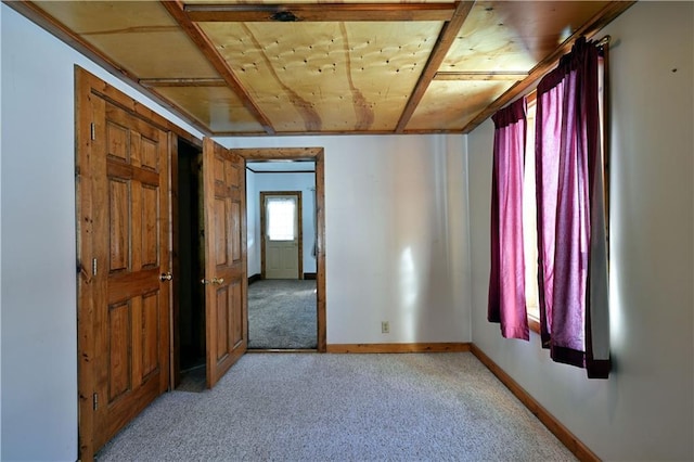 empty room with light colored carpet and baseboards