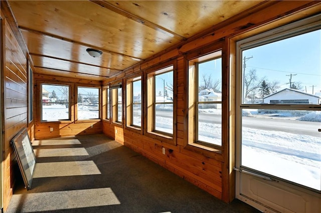 sunroom / solarium featuring wood ceiling