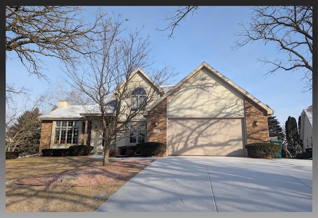 view of front facade with brick siding, a garage, driveway, and a chimney