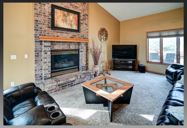 carpeted living room featuring a brick fireplace, baseboards, and vaulted ceiling