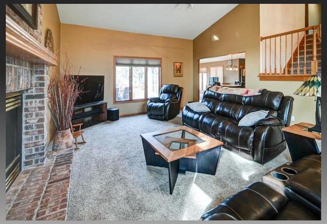 living room with a brick fireplace, carpet floors, and high vaulted ceiling