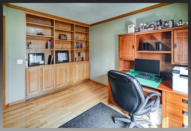 office space with light wood-type flooring, baseboards, and ornamental molding