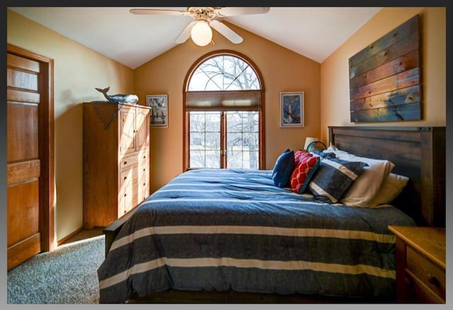 carpeted bedroom with ceiling fan and lofted ceiling