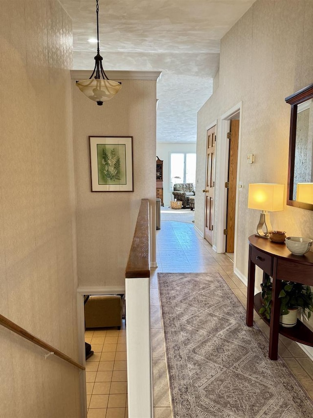 hallway with tile patterned flooring