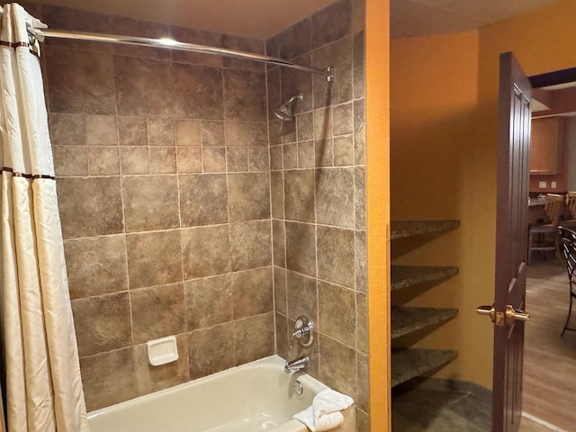 bathroom with shower / bath combination with curtain
