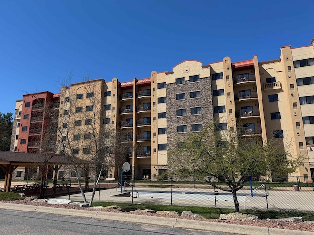 view of building exterior featuring fence