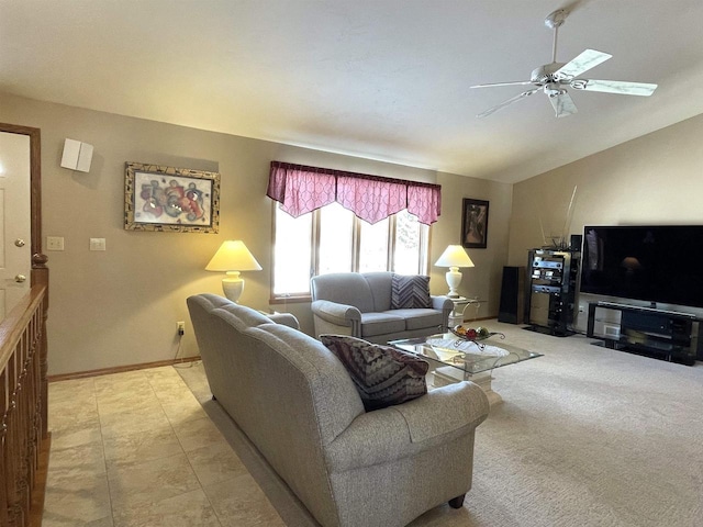 living room featuring baseboards, vaulted ceiling, and a ceiling fan