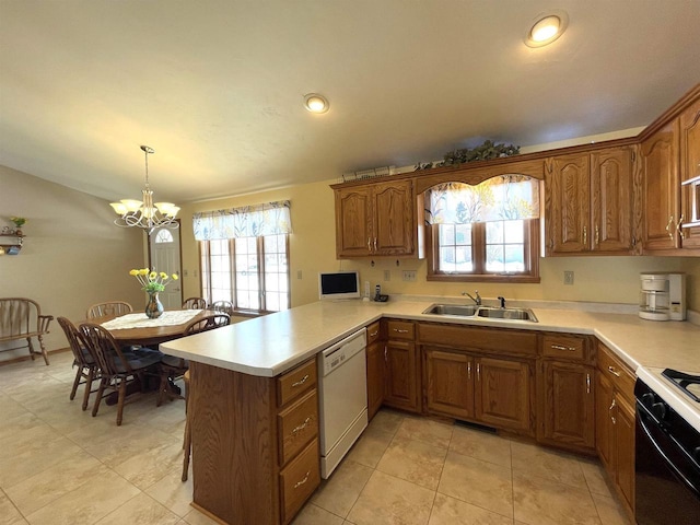 kitchen with white dishwasher, a peninsula, light countertops, brown cabinetry, and decorative light fixtures