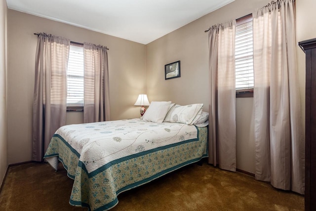 bedroom with dark carpet