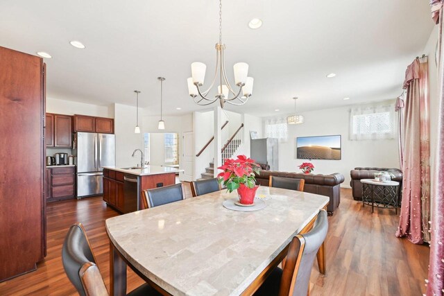 2418 Leopold Way, Sun Prairie, WI 53590 - dining area with dark wood-style floors, stairway, a chandelier, and recessed lighting