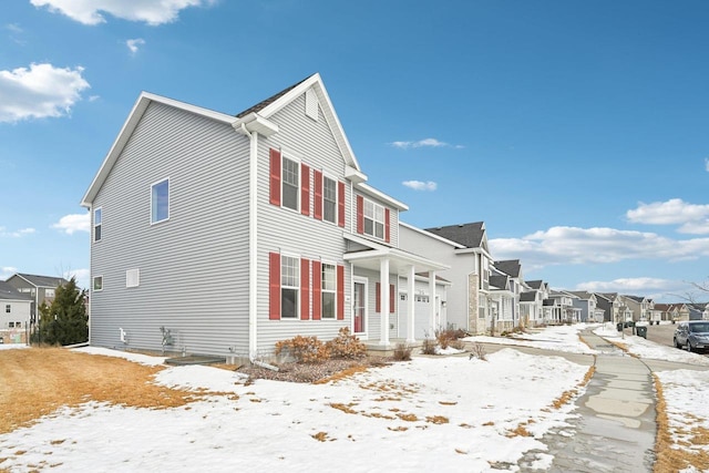 2418 Leopold Way, Sun Prairie, WI 53590 - snow covered property with a garage and a residential view