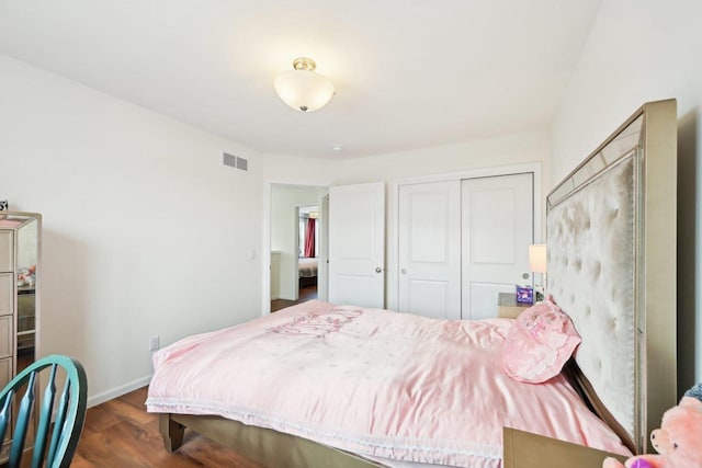 2418 Leopold Way, Sun Prairie, WI 53590 - bedroom featuring a closet, visible vents, dark wood finished floors, and baseboards