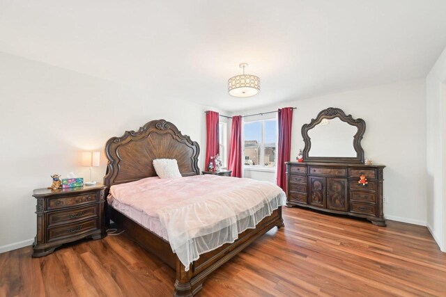 2418 Leopold Way, Sun Prairie, WI 53590 - bedroom with baseboards and wood finished floors