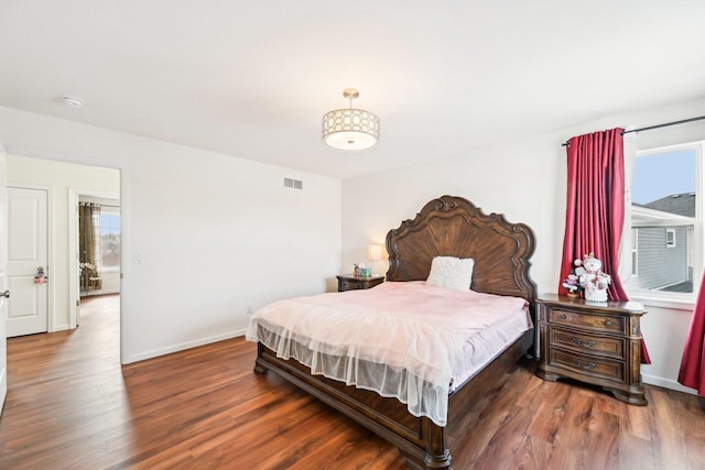 2418 Leopold Way, Sun Prairie, WI 53590 - bedroom with dark wood-type flooring, visible vents, and baseboards
