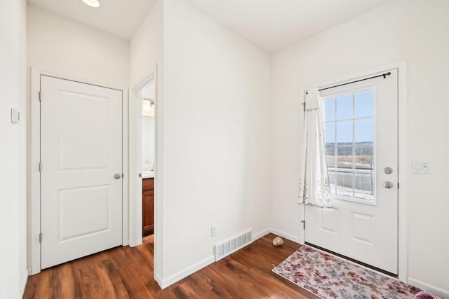 2418 Leopold Way, Sun Prairie, WI 53590 - foyer entrance with dark wood-style floors, visible vents, and baseboards
