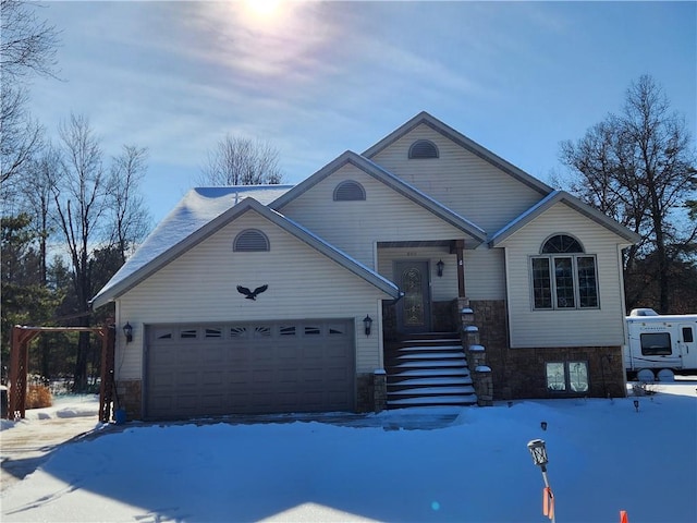 600 S Hayden St, Merrillan, WI 54754 - view of front of home featuring stone siding and an attached garage