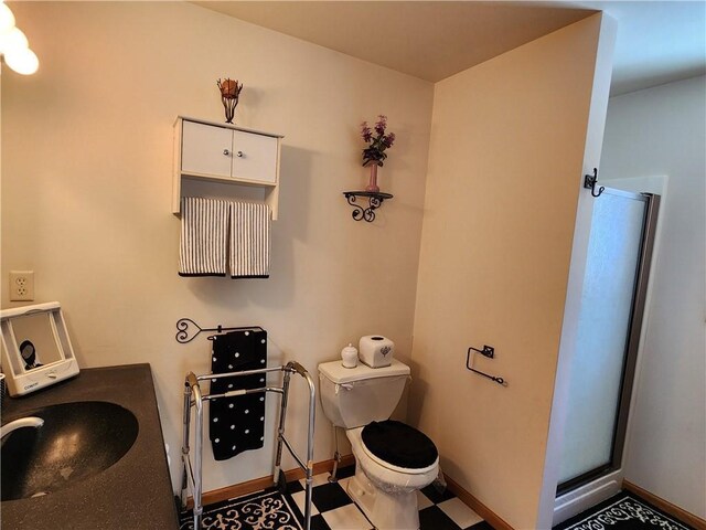 600 S Hayden St, Merrillan, WI 54754 - full bathroom with a sink, a shower stall, toilet, and baseboards