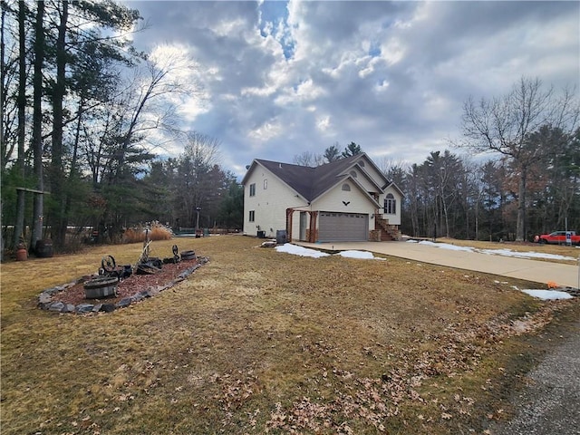 600 S Hayden St, Merrillan, WI 54754 - view of property exterior with concrete driveway and an attached garage